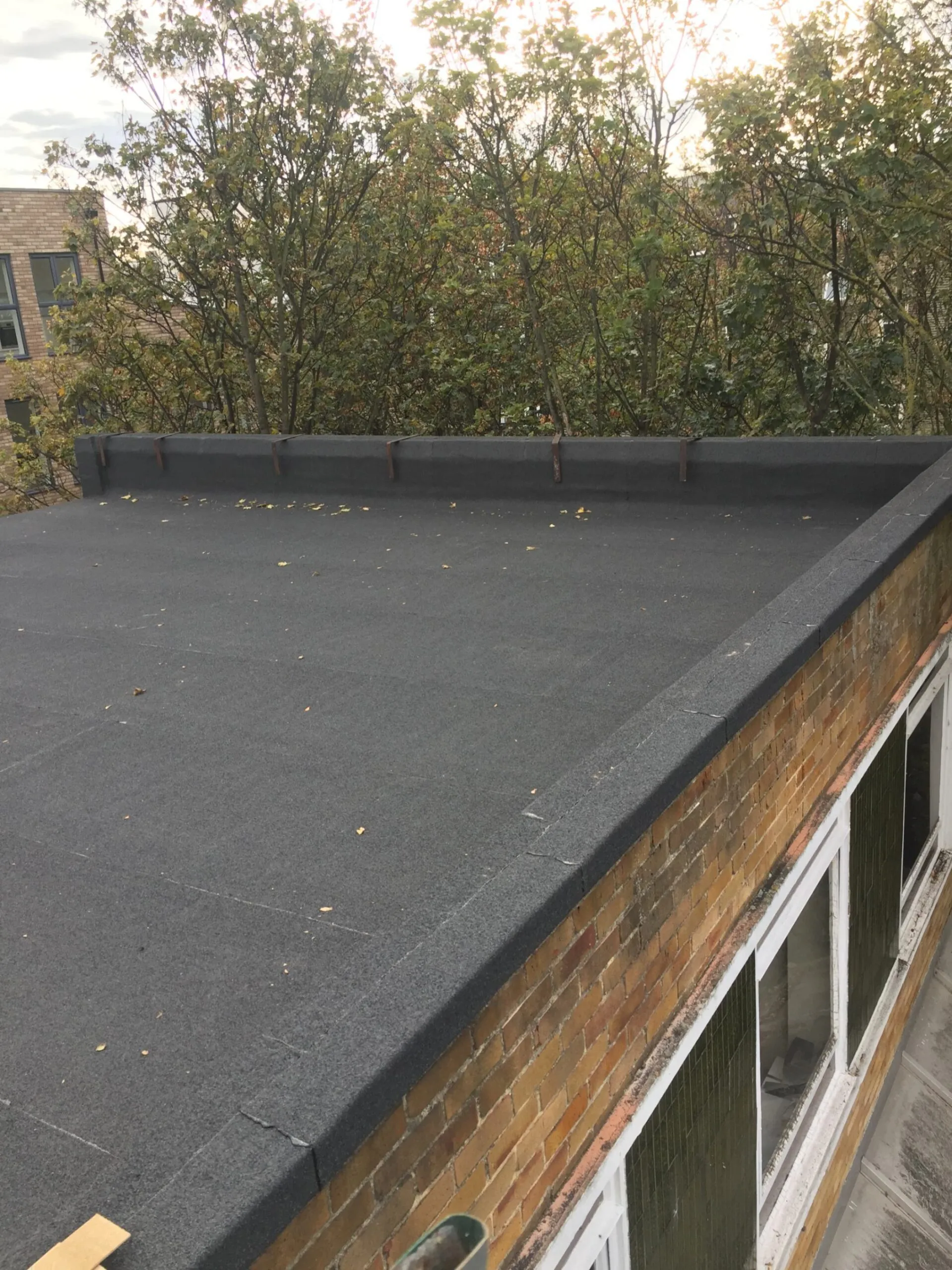 felt roofing on apartment block.
